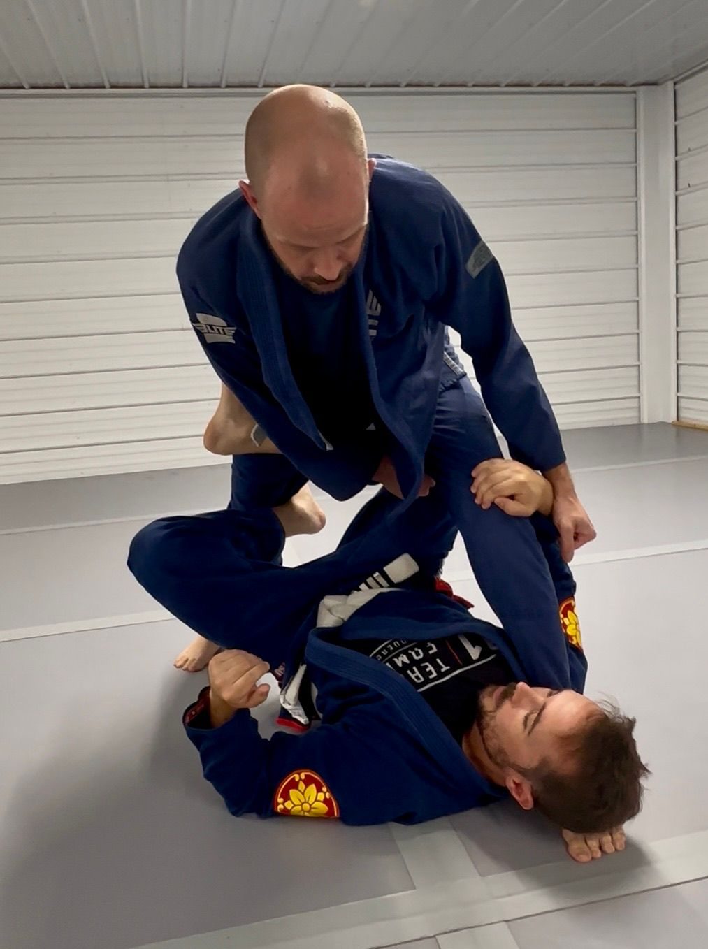 Moxie Jiu Jitsu students practicing a controlled ground position