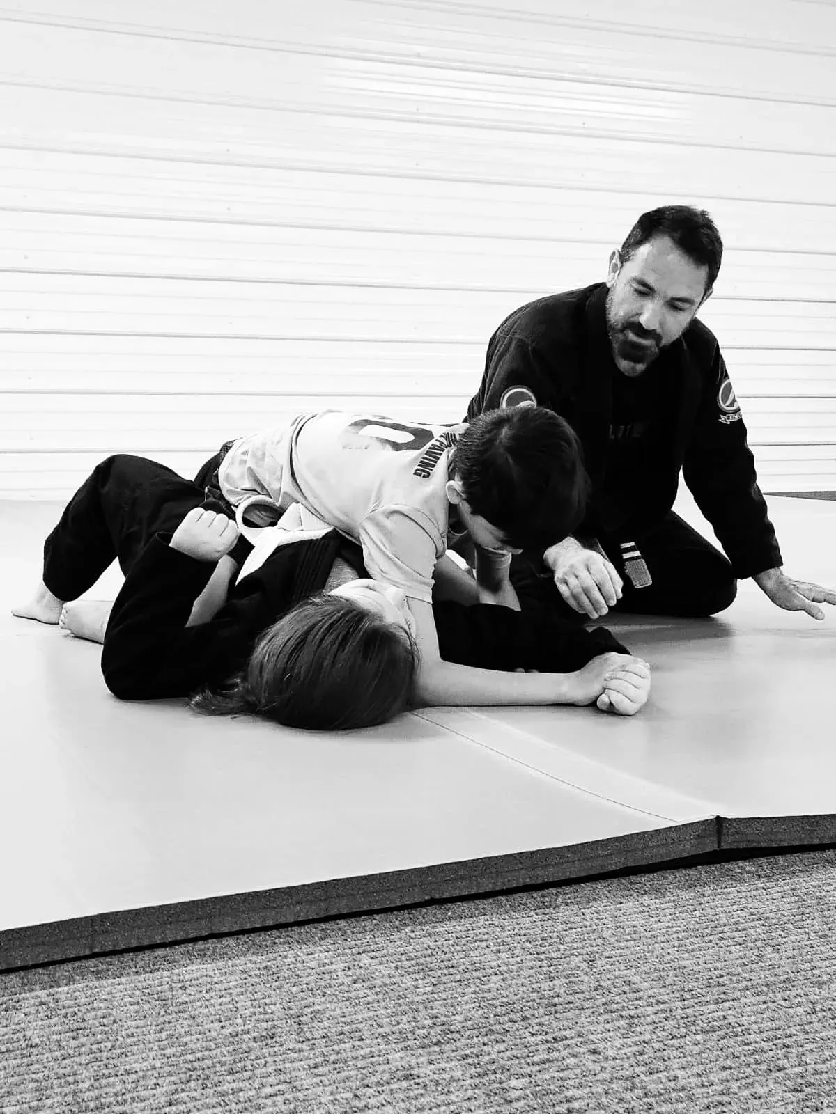 An instructor gives age-appropriate guidance to young students during class.